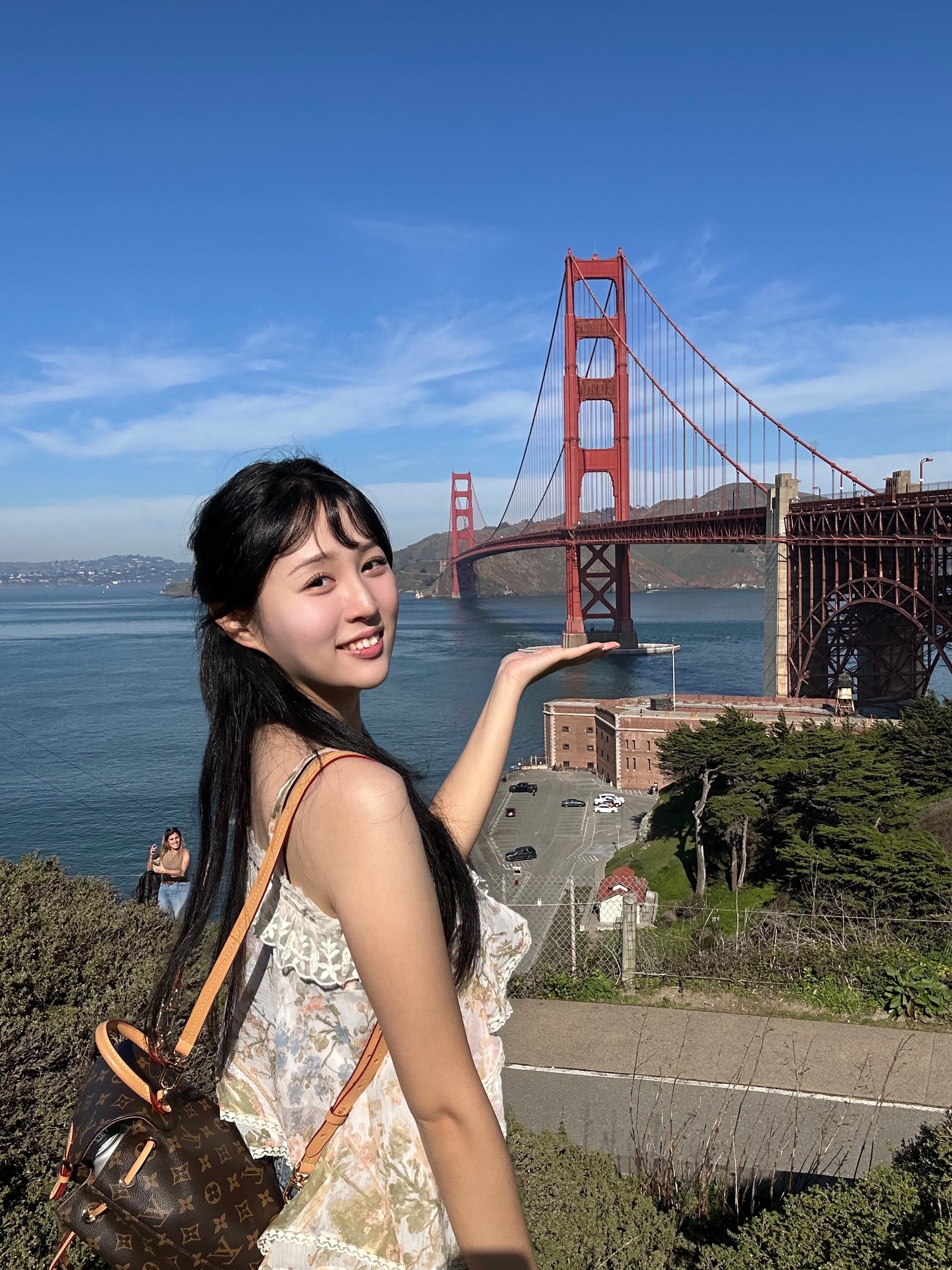 Sola Kim in front of the Golden Gate Bridge
